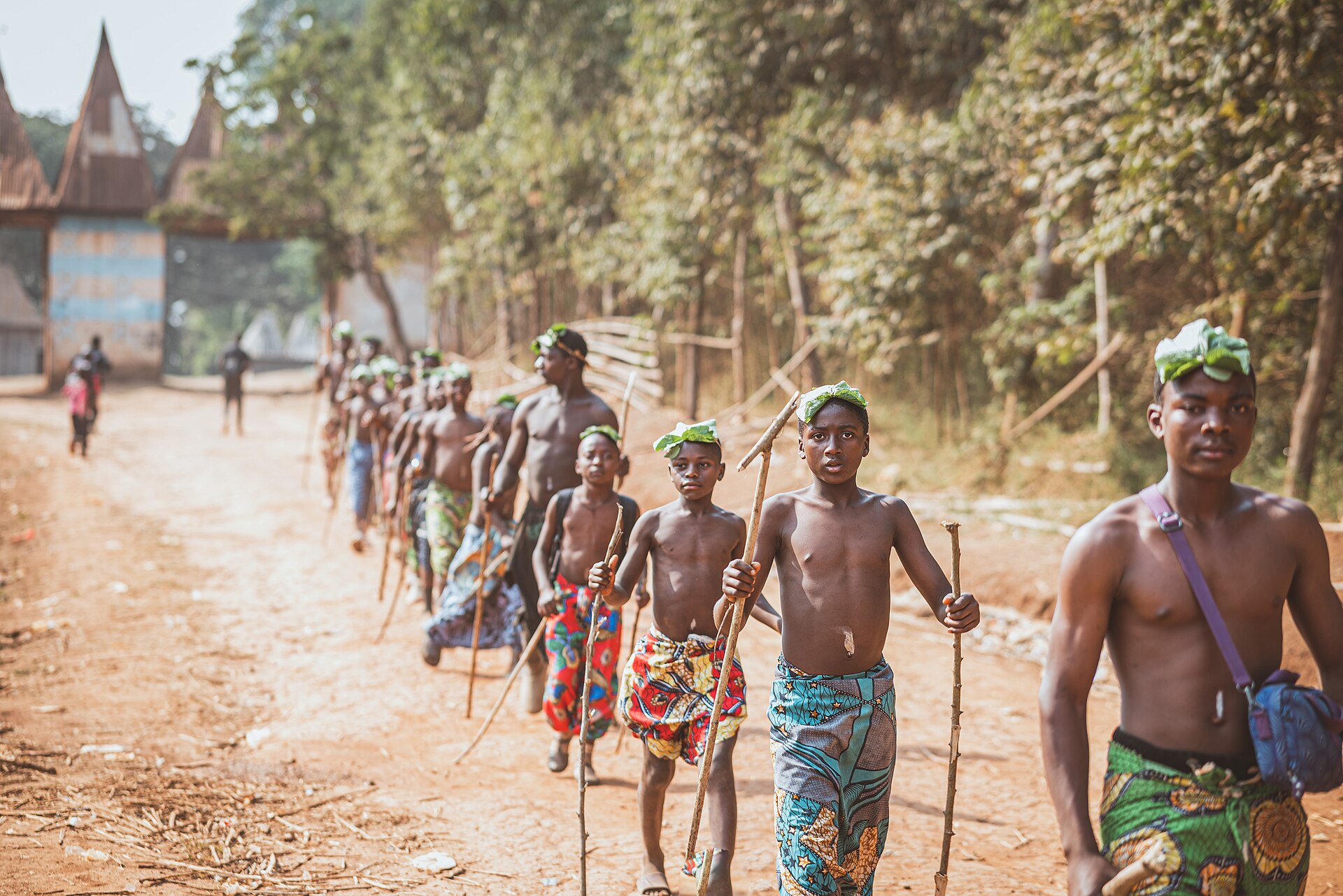 Young initiates walking in procession during a festival